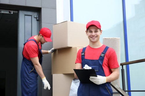 House movers helping a customer move in Camden with packed boxes and furniture