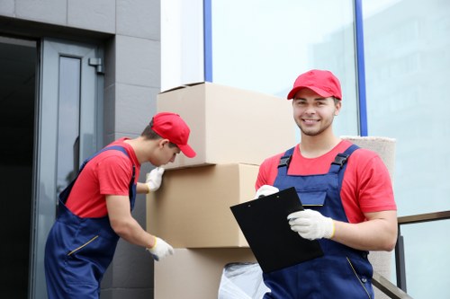 Professional movers handling furniture in a Camden property