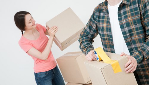 Professional packing team organising boxes in a Camden home
