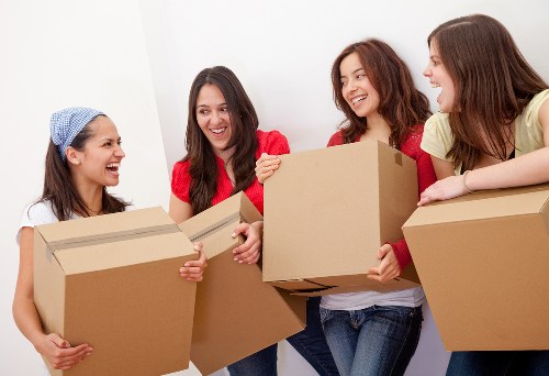 Removal team planning a house move on a Camden street