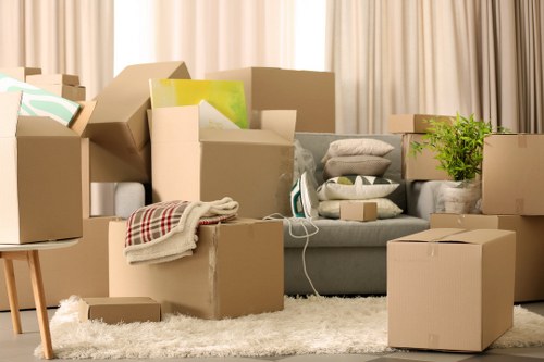 Staff handling furniture carefully during a house relocation