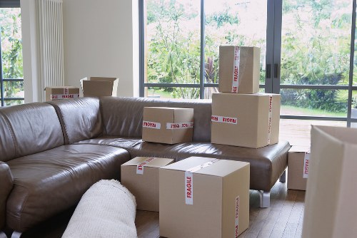 Boxes and furniture being loaded into a moving van in Camden