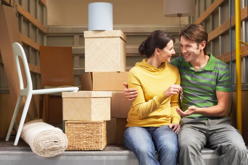 Staff using proper lifting techniques during a move